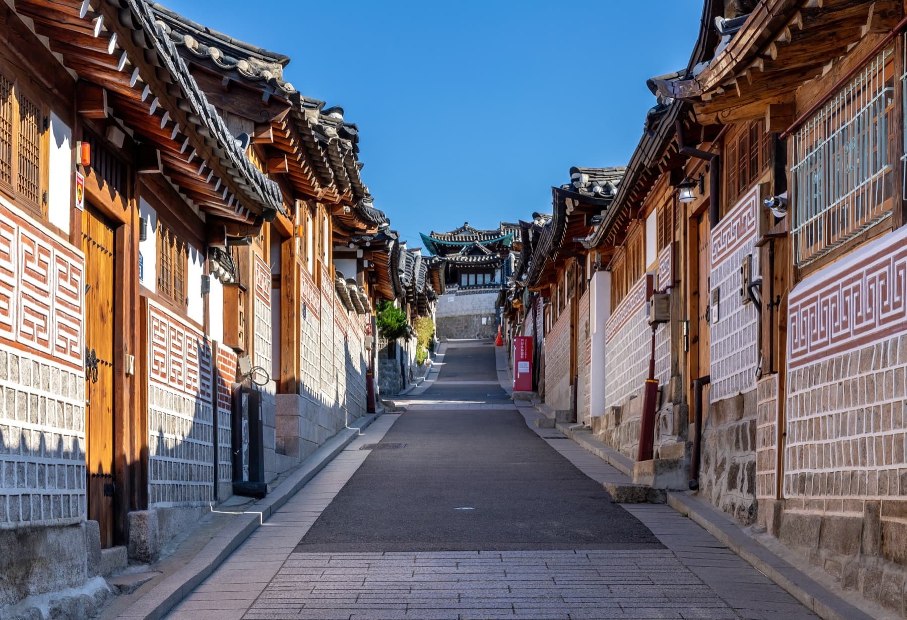 Quiet Bukchon hanok street under a clear sky in Seoul — What If Your Parents' Homeland Does Not Feel Like Yours?