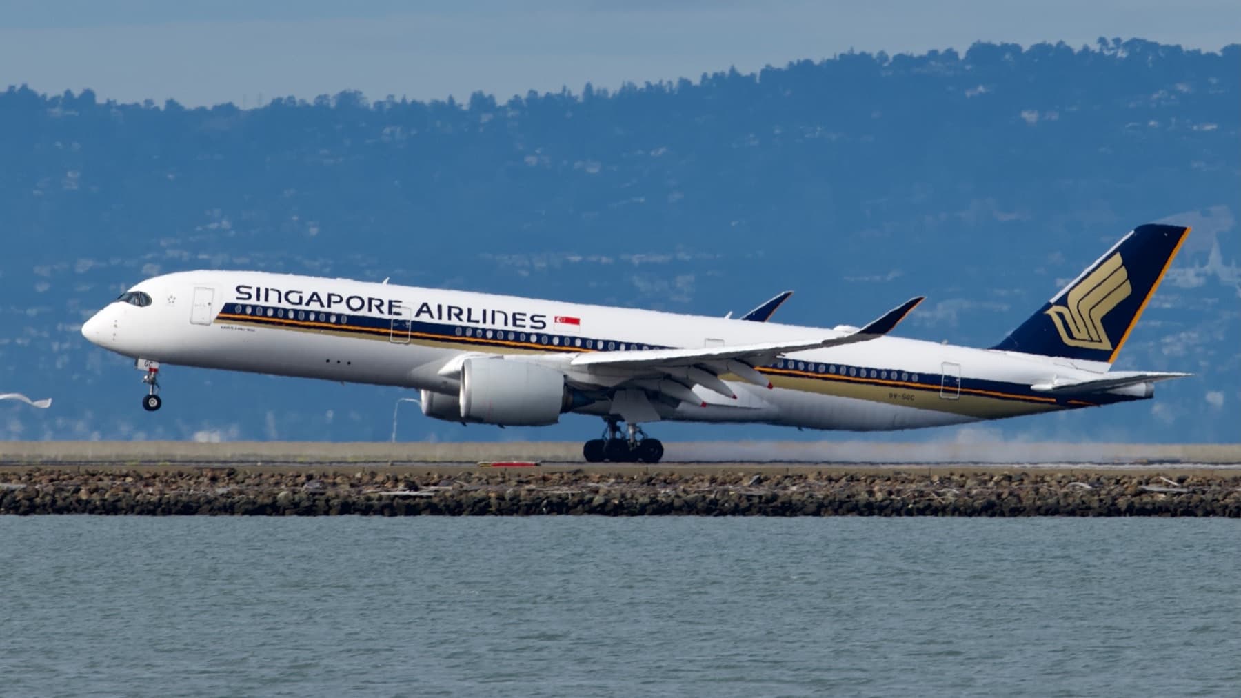 A Singapore Airlines Airbus A350 on final approach over the water at San Francisco